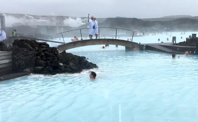 A serene view of the Blue Lagoon with mist rising from the warm waters